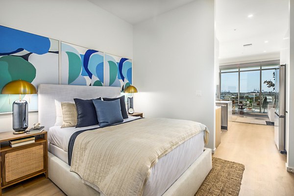 Modern bedroom with ocean views at 200 West Ocean Apartments, showcasing luxury living in Long Beach
