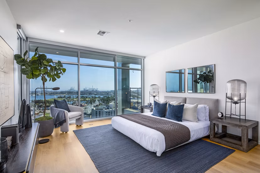 Elegant bedroom with ocean views at 200 West Ocean Apartments
