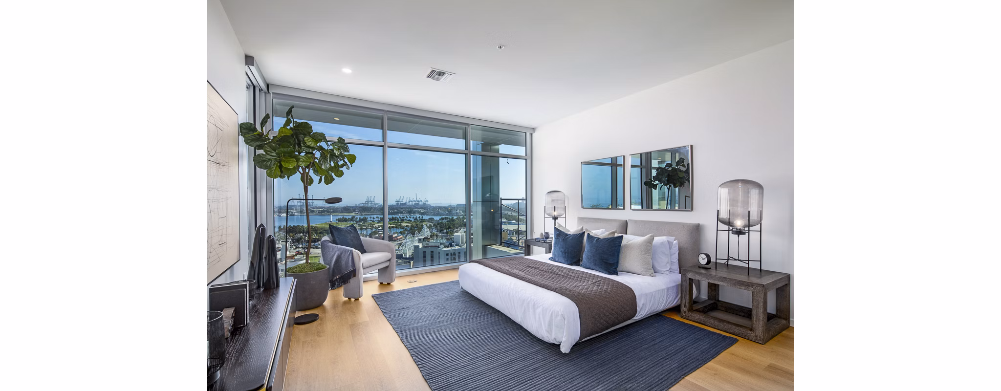 Elegant bedroom with ocean views at 200 West Ocean Apartments