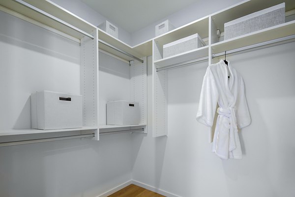 Spacious bedroom closet with built-in shelving at 200 West Ocean Apartments