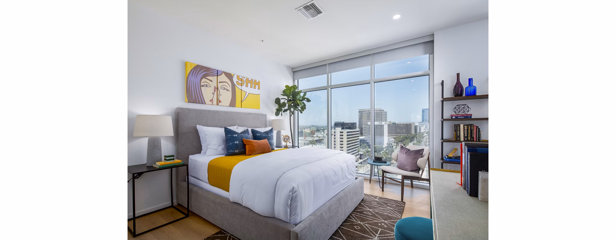 Elegant bedroom featuring ocean views and modern furnishings at 200 West Ocean Apartments