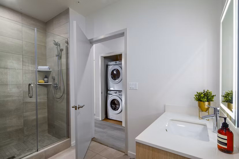 Bathroom with modern fixtures and elegant marble accents at 200 West Ocean Apartments