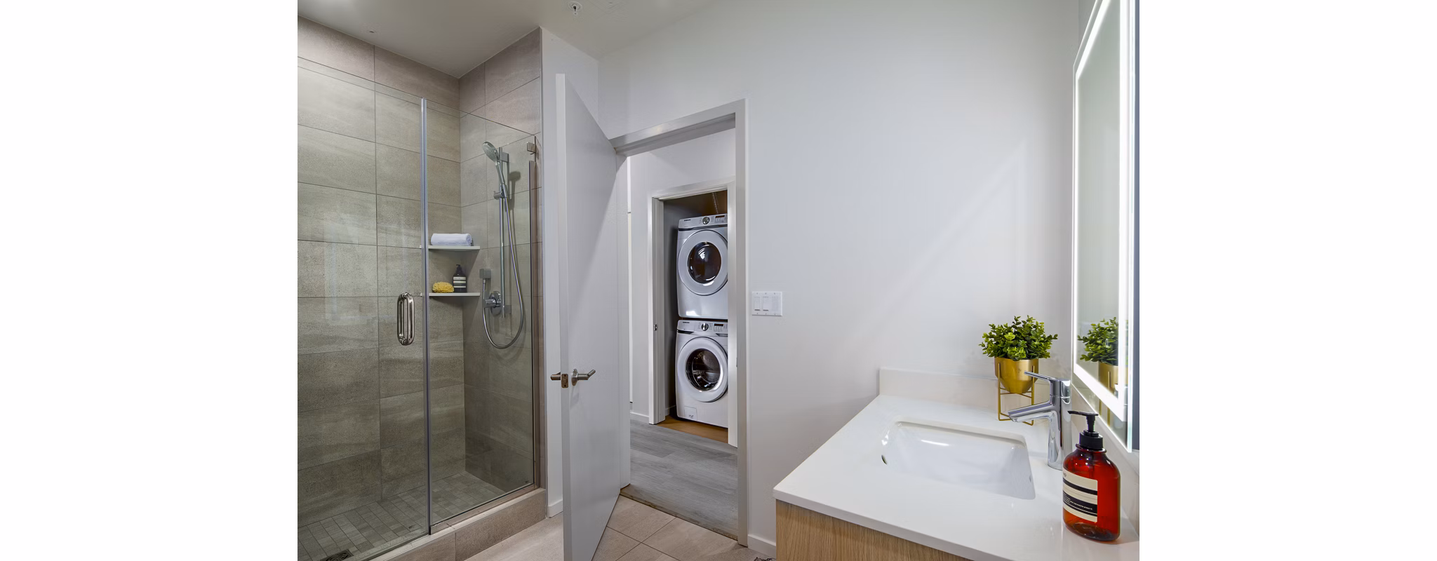 Bathroom with modern fixtures and elegant marble accents at 200 West Ocean Apartments