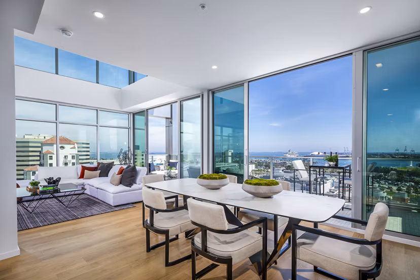 Dining area with modern decor and elegant lighting at 200 West Ocean Apartments
