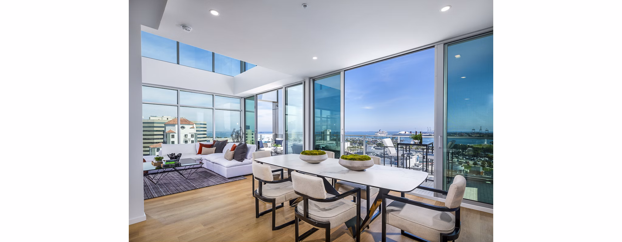 Dining area with modern decor and elegant lighting at 200 West Ocean Apartments