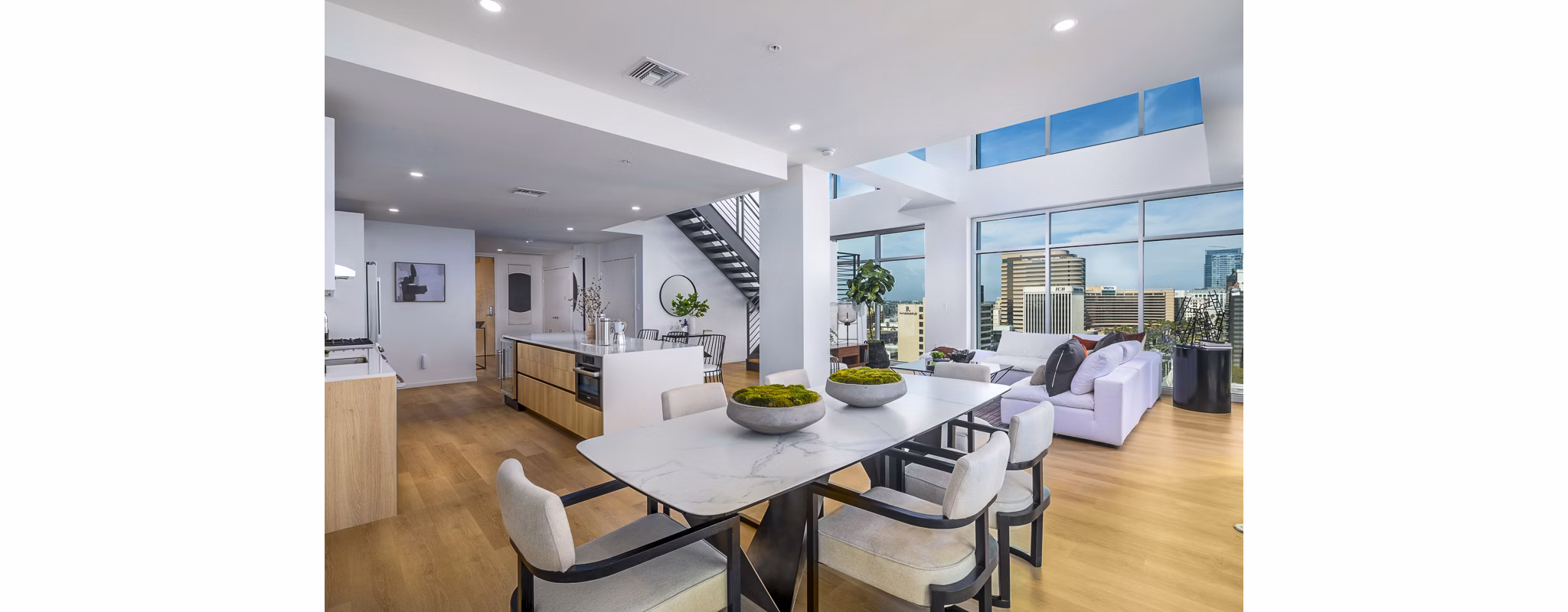 Dining room with modern decor and sleek furnishings at 200 West Ocean Apartments