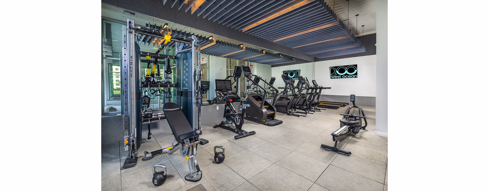 Fitness center with modern equipment at 200 West Ocean Apartments, offering state-of-the-art facilities for active living and wellness