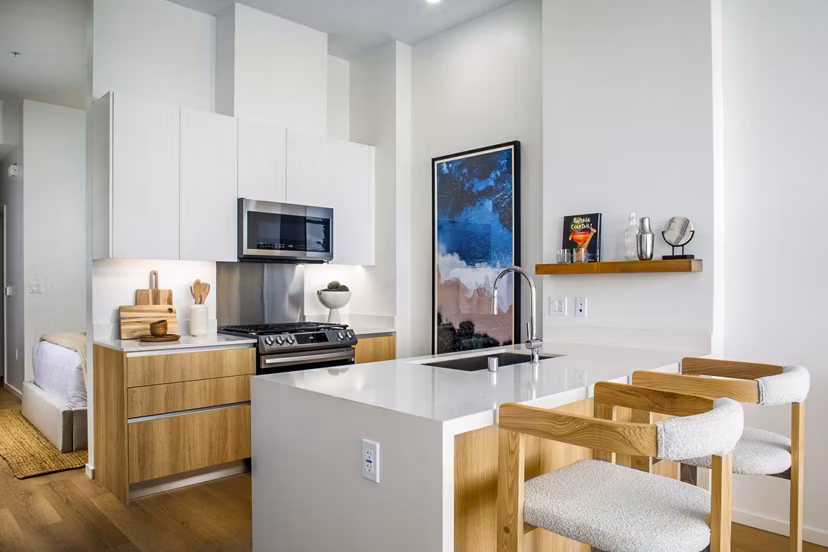 Modern kitchen with sleek cabinetry and stainless steel appliances at 200 West Ocean Apartments, a Greystar luxury residence
