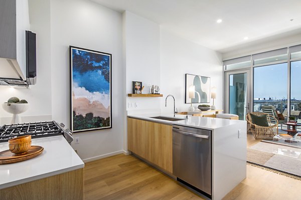 Modern kitchen with sleek cabinetry and stainless steel appliances at 200 West Ocean Apartments