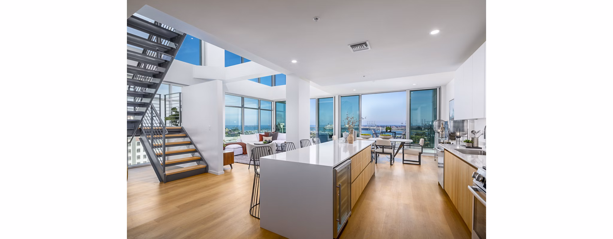 Modern kitchen with stainless steel appliances at 200 West Ocean Apartments in luxury Greystar community