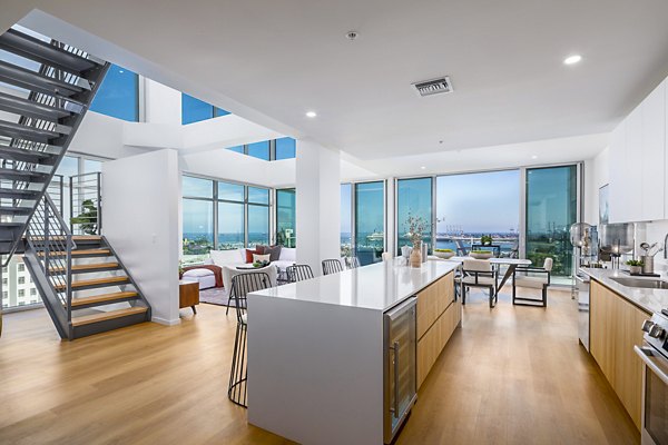 Modern kitchen with stainless steel appliances at 200 West Ocean Apartments in luxury Greystar community