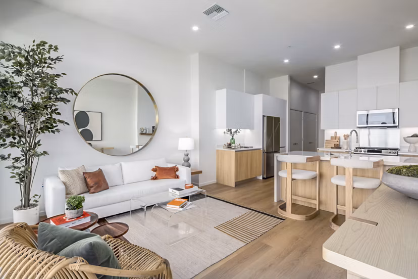 Spacious living room with ocean views at 200 West Ocean Apartments