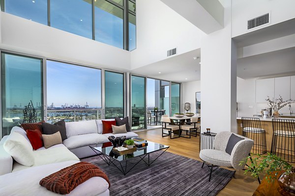 Spacious living room with modern decor at 200 West Ocean Apartments