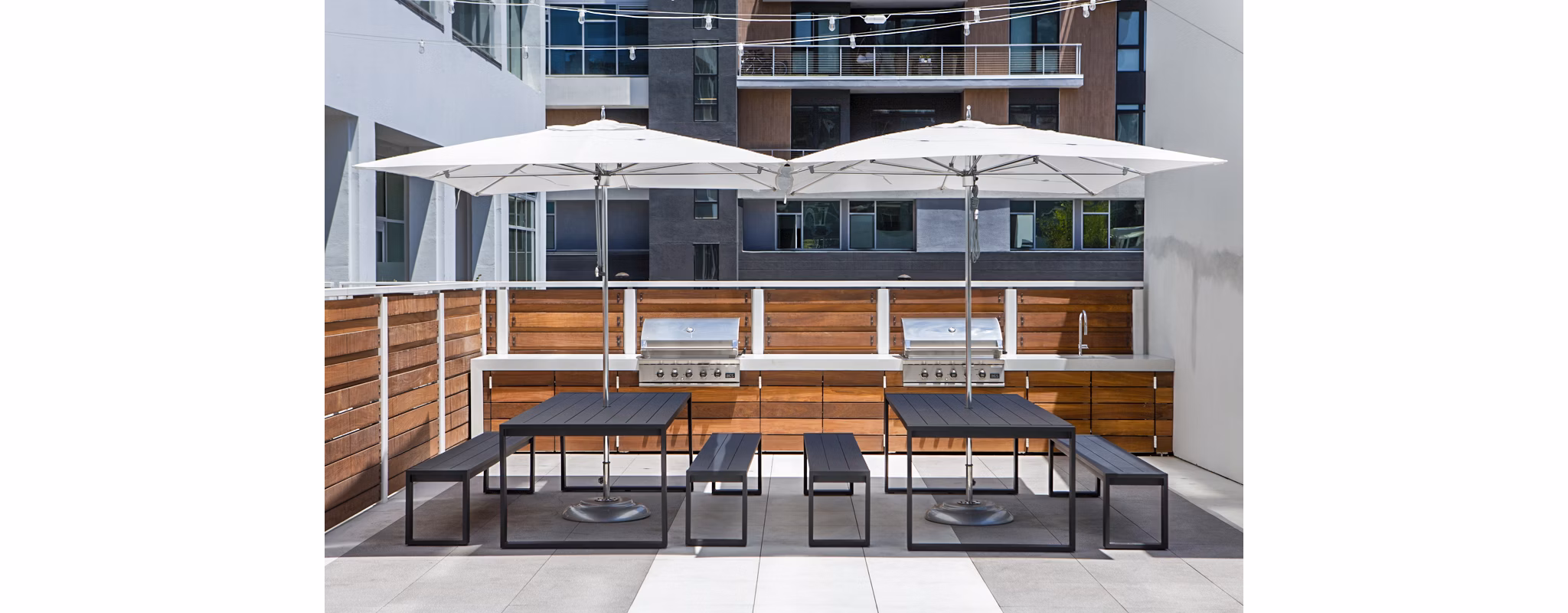Outdoor grill area on the patio at 200 West Ocean Apartments, perfect for social gatherings and enjoying alfresco dining