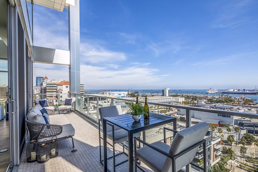 Patio with modern seating and ocean views at 200 West Ocean Apartments