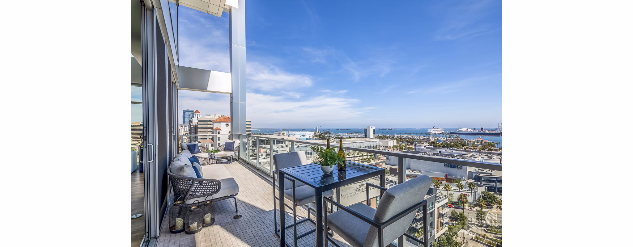 Patio with modern seating and ocean views at 200 West Ocean Apartments