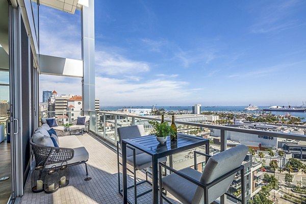 Patio with modern seating and ocean views at 200 West Ocean Apartments