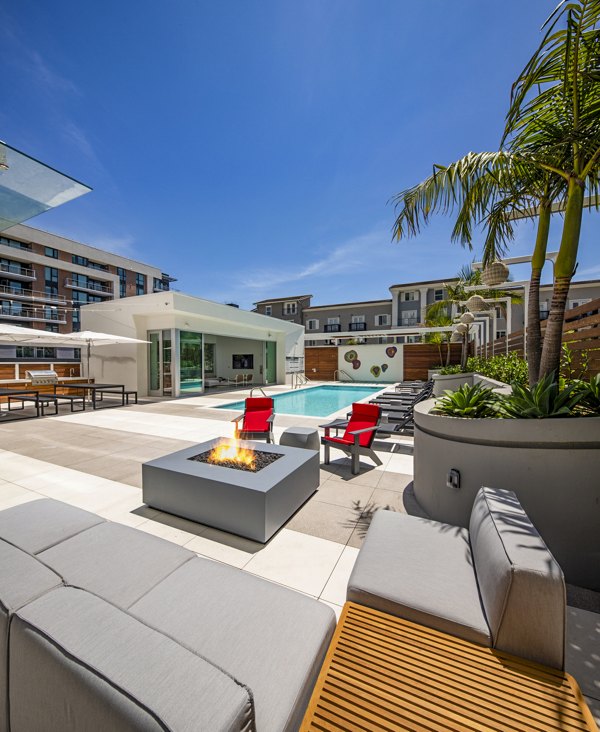 Inviting fire pit and pool area at 200 West Ocean Apartments