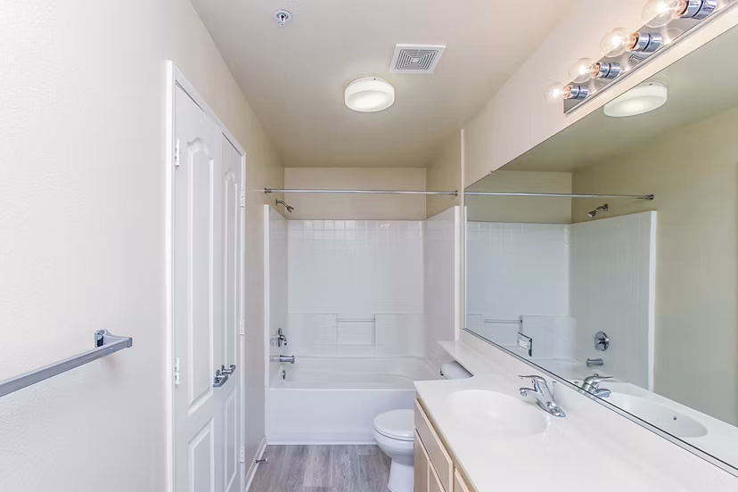 Modern bathroom featuring sleek fixtures at Waterford Place Apartments, highlighting luxury living and contemporary design