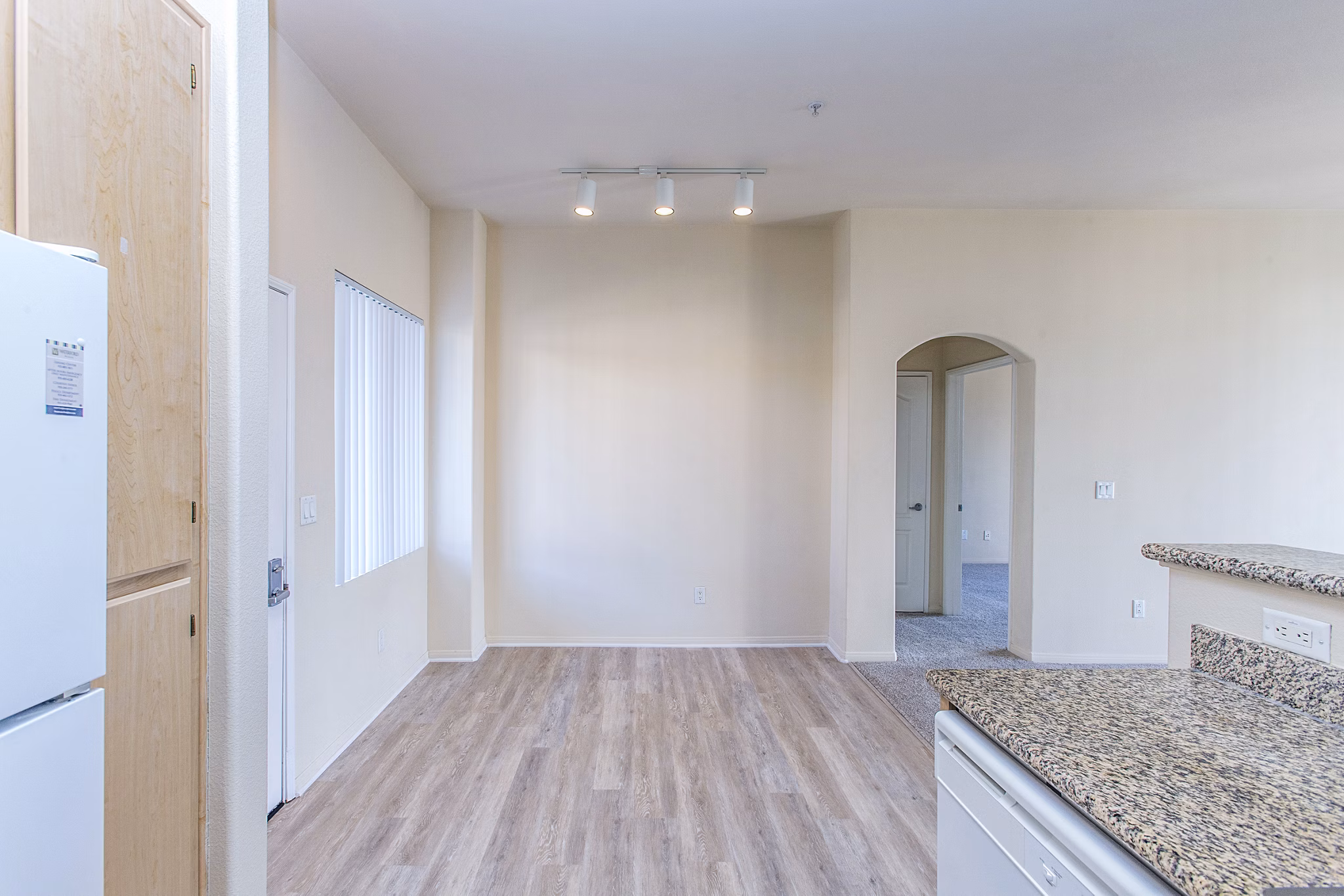 Dining room with elegant lighting and modern furnishings at Waterford Place Apartments, a Greystar luxury property