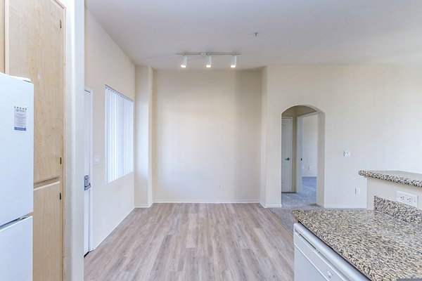 Dining room with elegant lighting and modern furnishings at Waterford Place Apartments, a Greystar luxury property
