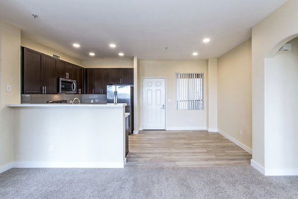 Dining room with elegant lighting and modern furnishings at Waterford Place Apartments