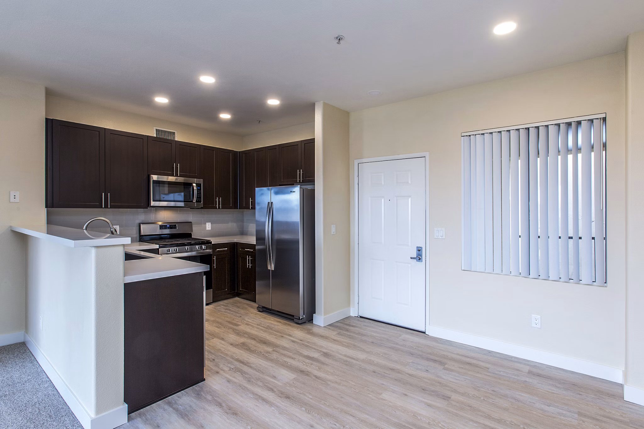 Dining room with elegant lighting and modern furniture at Waterford Place Apartments, luxury living by Greystar