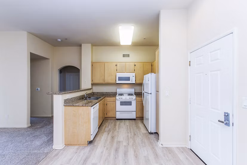 Modern kitchen with stainless steel appliances at Waterford Place Apartments
