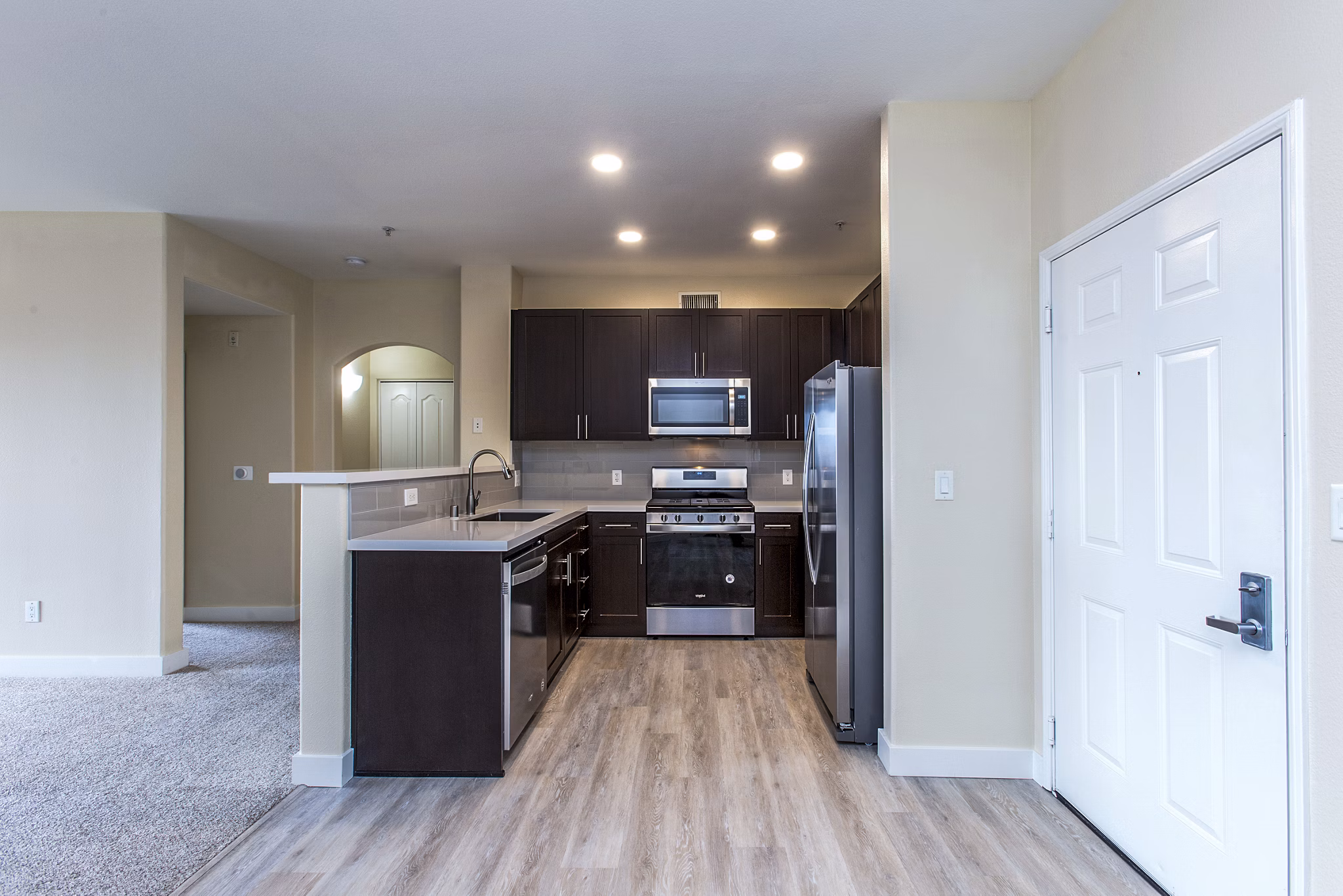 Modern kitchen with stainless steel appliances in Waterford Place Apartments Bright and spacious layout ideal for cooking and entertaining