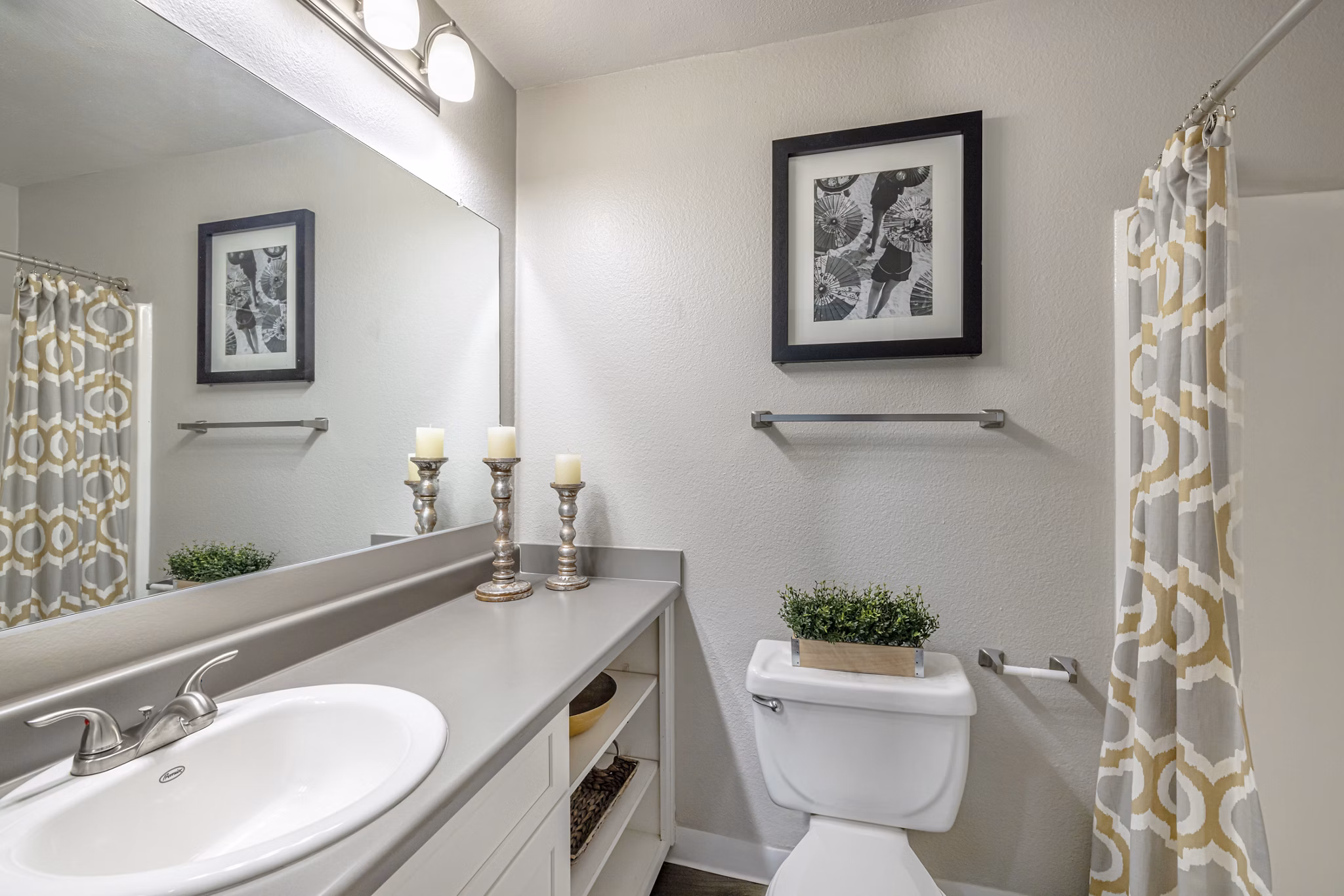 Bathroom featuring sleek countertops and modern fixtures at The Breakwater Apartments