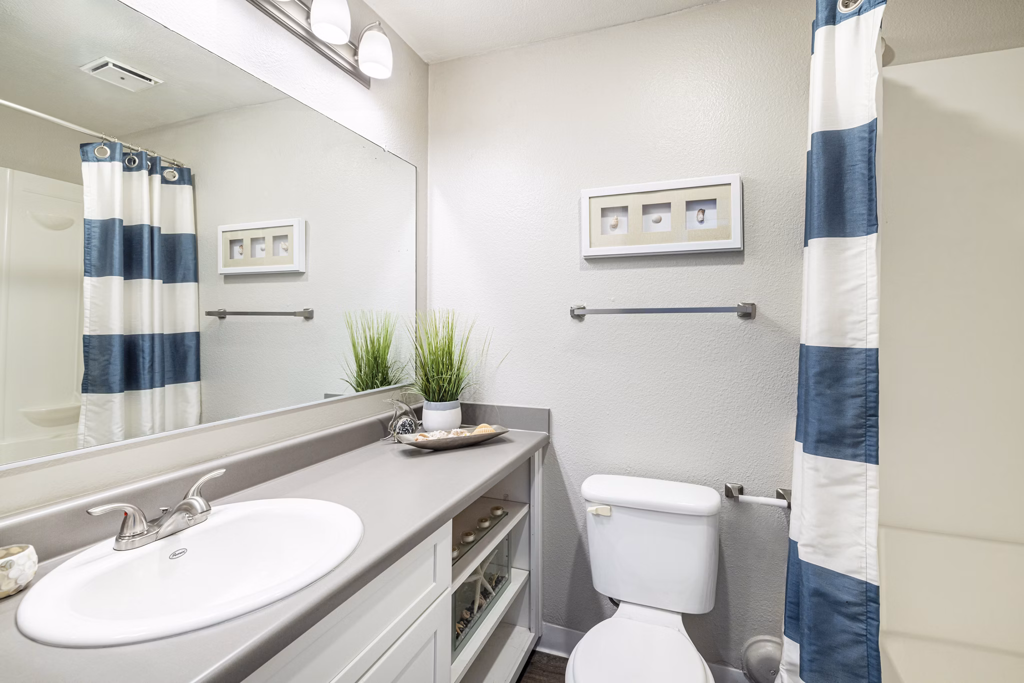 Elegant bathroom with modern fixtures at The Breakwater Apartments, offering luxury living and style