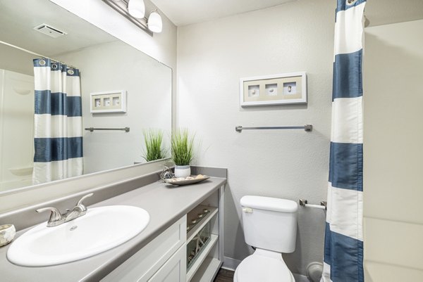 Elegant bathroom with modern fixtures at The Breakwater Apartments, offering luxury living and style