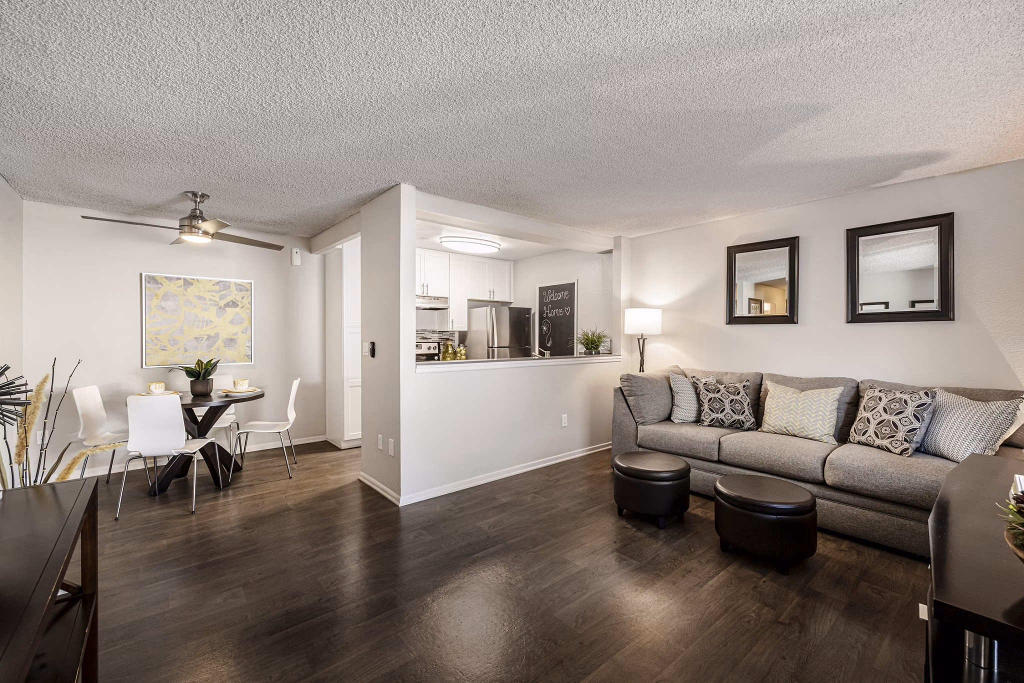 Spacious living room with modern furnishings and ocean views at The Breakwater Apartments, luxury living spaces in a coastal setting