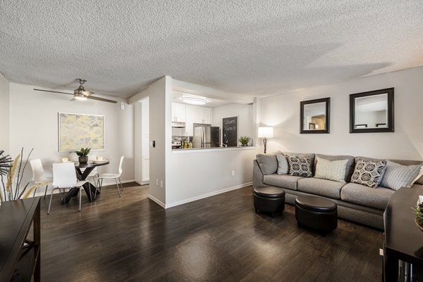 Spacious living room with modern furnishings and ocean views at The Breakwater Apartments, luxury living spaces in a coastal setting