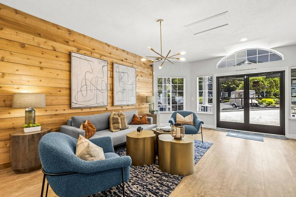 Stylish clubhouse with contemporary seating and lighting in Avana Chestnut Hills Apartments