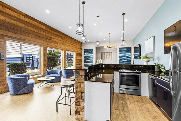 Clubhouse game room featuring pool table and lounge seating at Avana Chestnut Hills Apartments