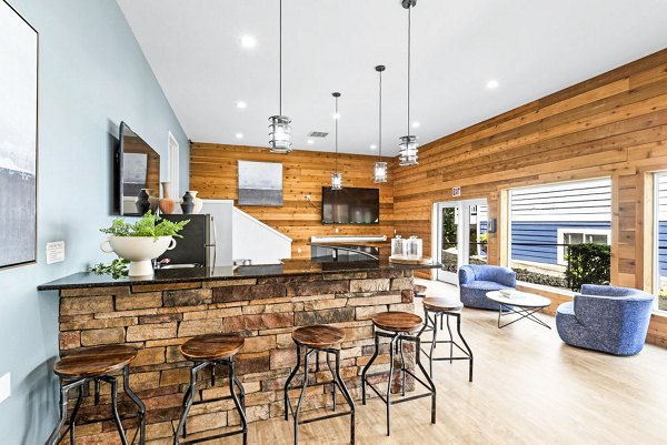 Clubhouse game room with pool table and seating area at Avana Chestnut Hills Apartments, offering luxury entertainment spaces