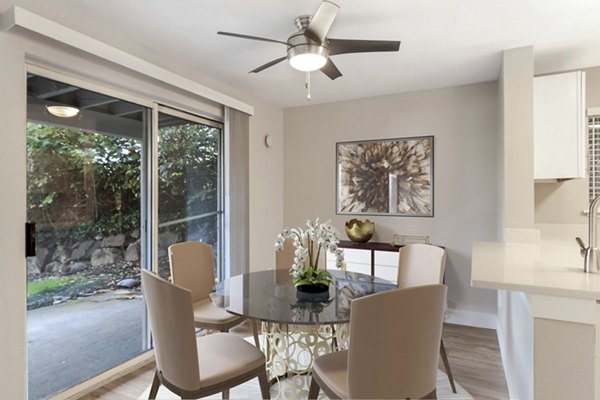 Dining area with modern decor and natural light in Avana Chestnut Hills Apartments, a Greystar luxury property