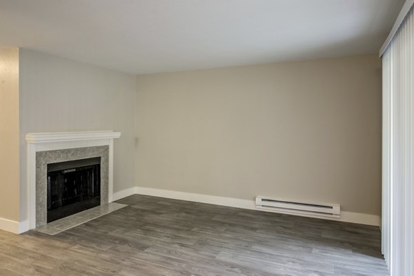 Cozy living room with stylish furnishings in Avana Chestnut Hills Apartments, offering a luxurious living experience in a prime location