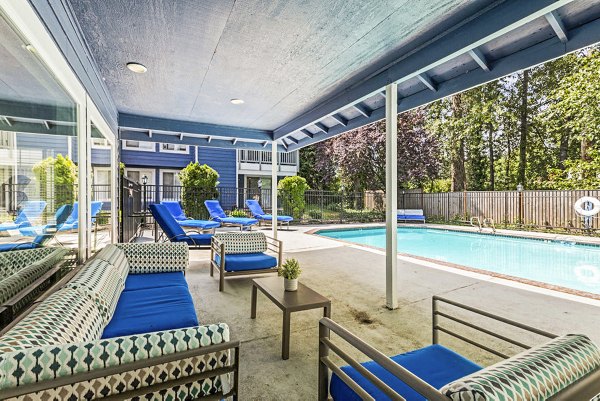 Inviting outdoor pool and patio at Avana Chestnut Hills Apartments, perfect for relaxation and social gatherings