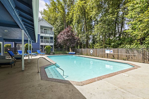 Modern outdoor pool at Avana Chestnut Hill Apartments offering luxurious amenities and relaxing environment for residents