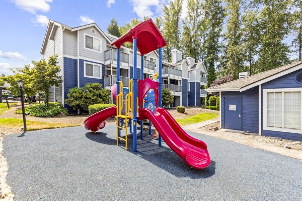 Playground with colorful equipment at Avana Chestnut Hills Apartments offering fun outdoor activities for children