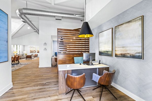 Clubhouse lobby with modern seating and bright lighting at Avana Hamptons Apartments, offering a welcoming space for residents