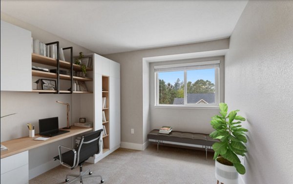 Home office with stylish workspace and natural light in Avana Hamptons Apartments