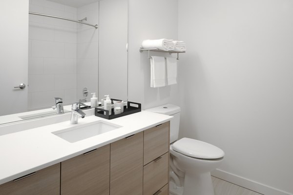Bathroom with modern fixtures and sleek design at The Payton Apartments