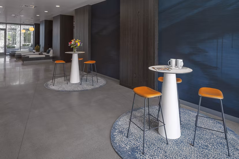 Clubhouse featuring luxurious seating and modern design at The Payton Apartments