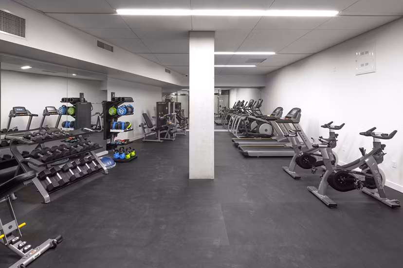 State-of-the-art fitness center featuring modern equipment at The Payton Apartments, perfect for active lifestyles and wellness-focused living