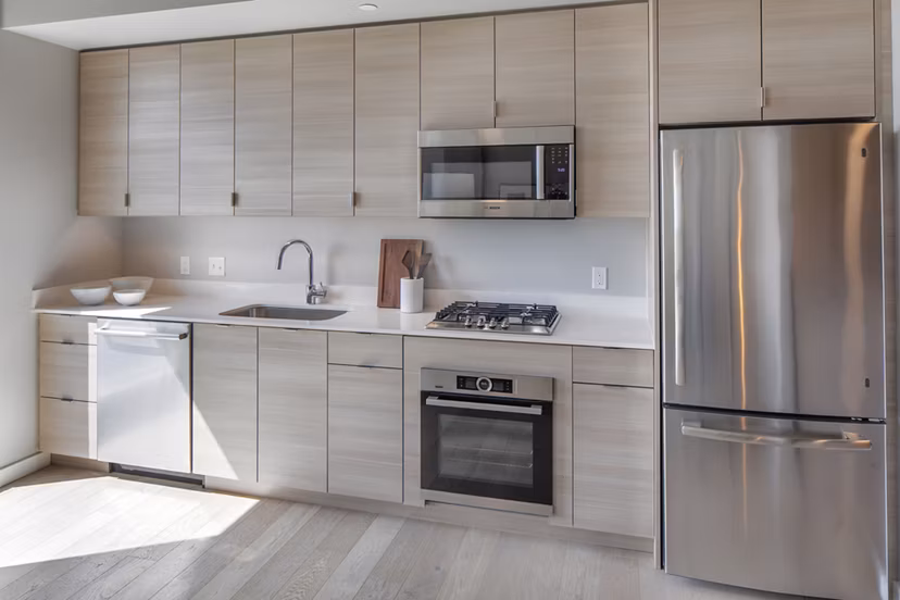 Spacious kitchen with modern appliances at The Payton Apartments