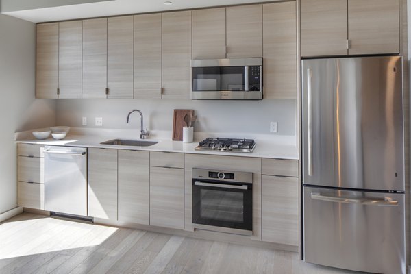 Spacious kitchen with modern appliances at The Payton Apartments