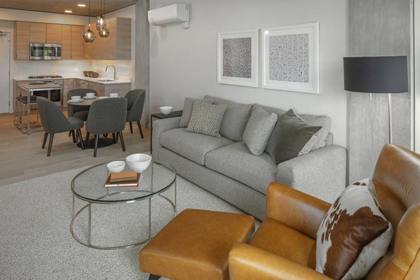 Spacious living room with contemporary furnishings at The Payton Apartments, a Greystar luxury community